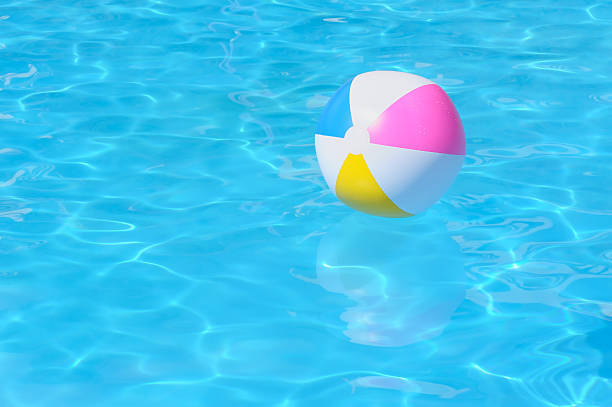 istock Inflatable multy colored plastic ball in swimming pool 158936000