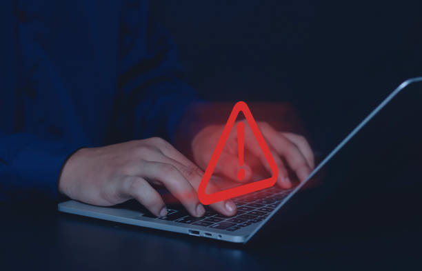 istock Businessman or employee with a triangle warning sign 1589369205