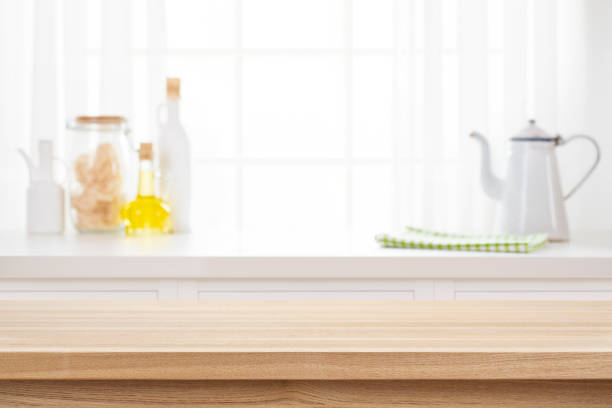 istock Blurred modern kitchen counter and table top for product display 1589379561