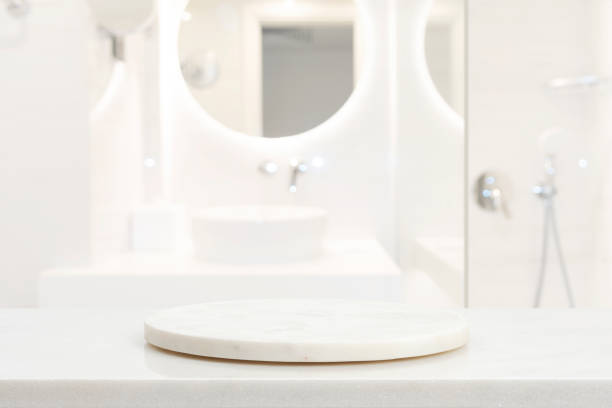 istock Empty marble podium in blurred bathroom to place your design 1589379942