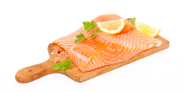 istock fresh salmon fillet on board isolated on white background 1589391521