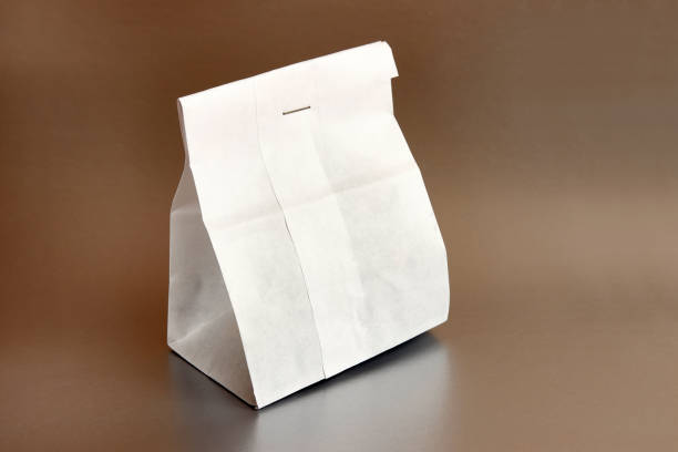 istock Paper bag with coffee beans, sewn with thread. Dry food packaging. 1589393671