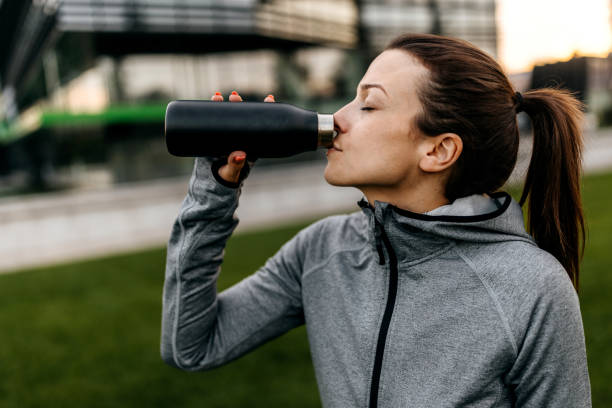 istock Fitness woman drinking water 1589395854