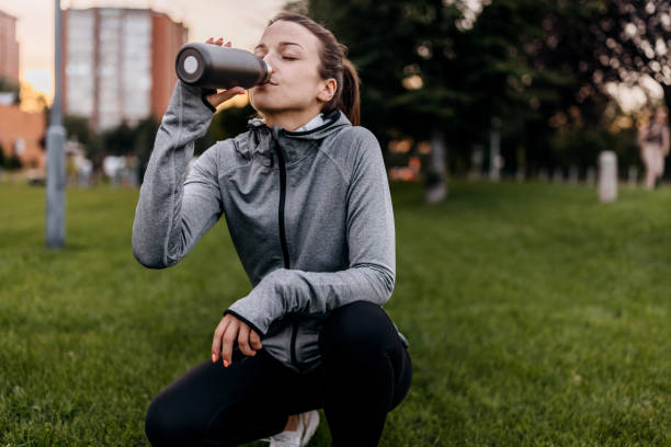 istock Fitness woman drinking water 1589396925