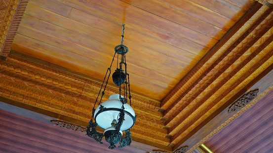 old white chandelier on the ceiling.