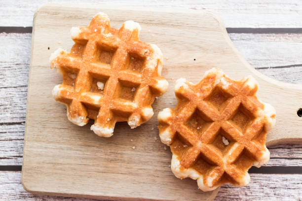 istock Belgian waffles with berries. Morning. On a wooden background 1589413620