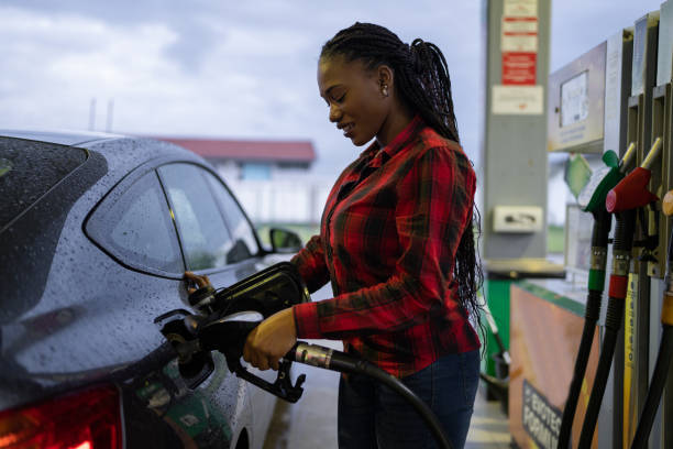 istock Woman refueling her car 1589419571