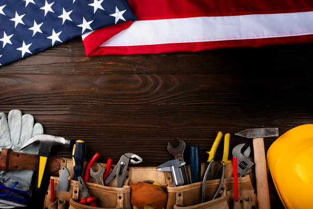 istock Tools hardhat toolbelt and us flag on wooden background labor day banner mockup 1589425451