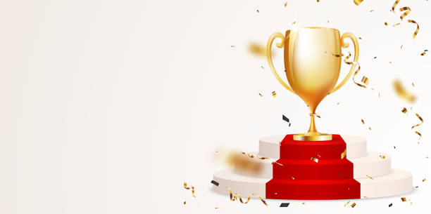 istock Golden Trophy cup on red round podium with gold confetti 1589434078