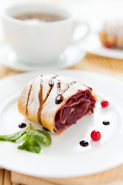 istock cherry strudel on white plate and a cup of tea 158944397