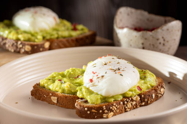 istock Wholemeal toast with avocado and poached egg. 1589455442