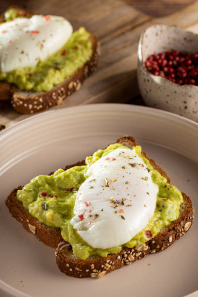 istock Wholemeal toast with avocado and poached egg. 1589455453