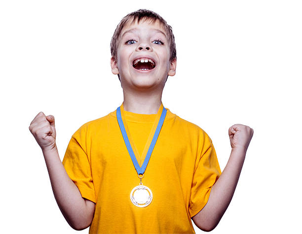 istock Happy child with medal isolated on white 158945698