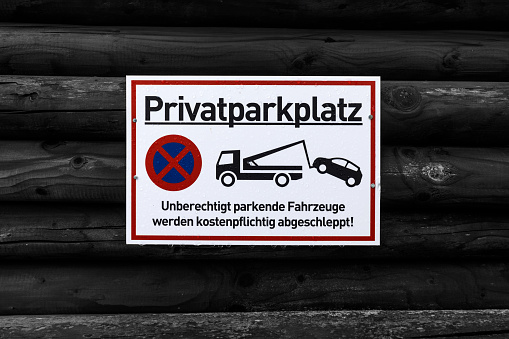 Private property, parked cars will be towed away for a fee