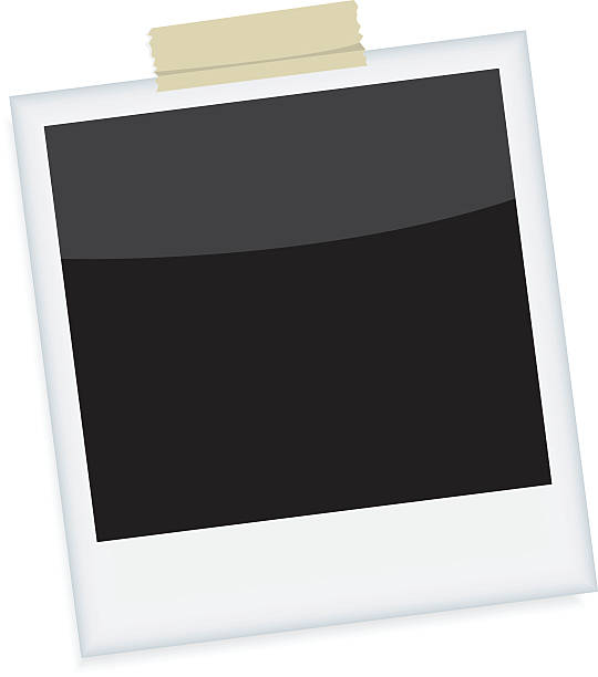 istock An image of a blank instant photograph, taped to a wall 158946692