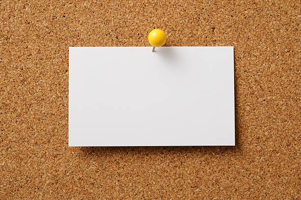 Pin-up of blank business card on cork board Pin-up of blank business card on cork board . bulletin board stock pictures, royalty-free photos & images