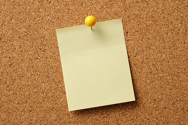 istock Close-up of cork board with yellow sticky note 158947022