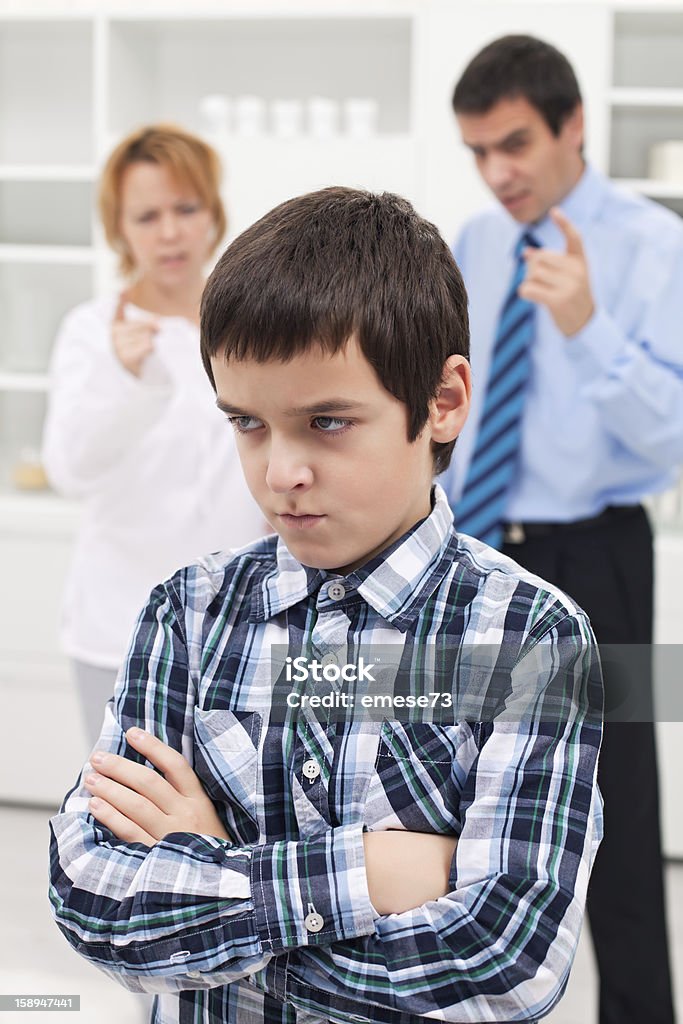 Conflict in family Parents punishing his sad child Adult Stock Photo