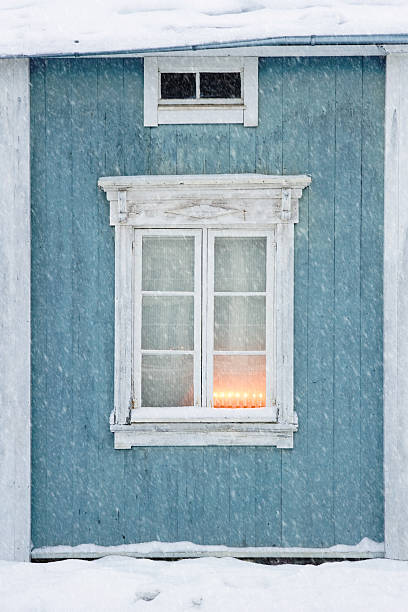 istock Old wooden house exterior in snowfall 158947682