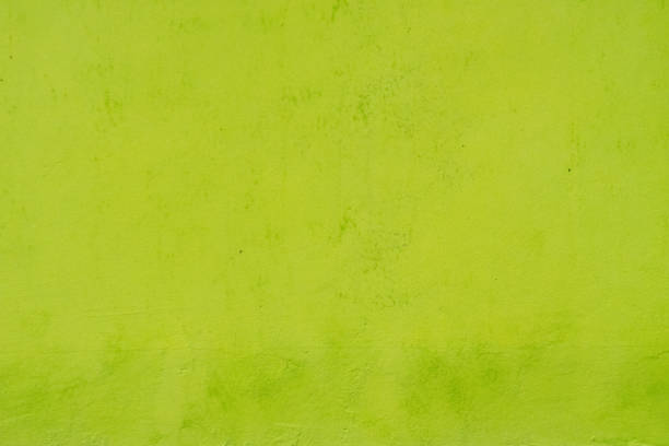 istock Bright yellow painted wall detail texture 1589483425