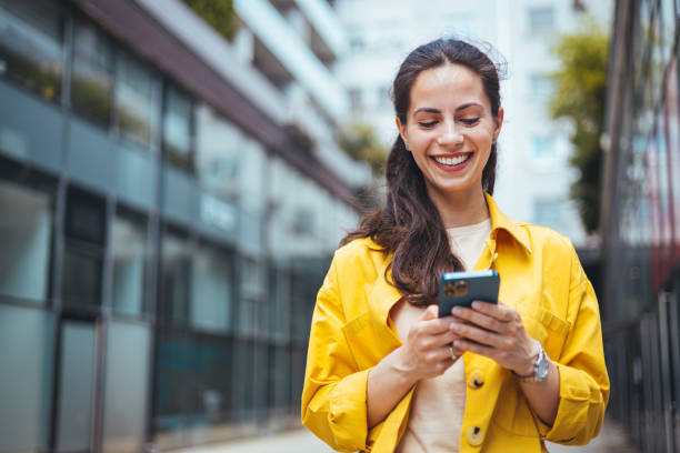 istock Happy woman talking on smart phone. 1589492100