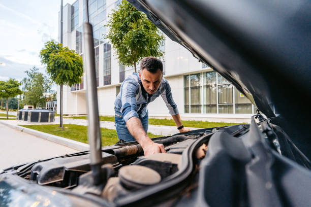 istock Young Man Having Car Problems On The Street 1589504966
