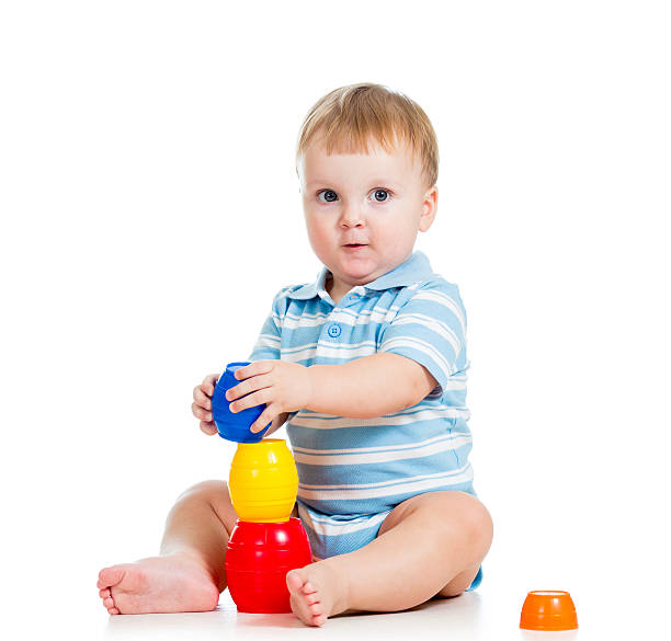 istock baby boy playing with toys, isolated over white 158950883
