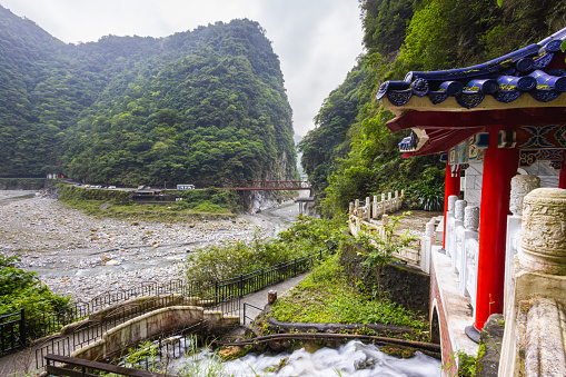 Taroko National Park, Taiwan - May 23, 2023: Picturesque Eternal Spring Shrine showcases the breathtaking beauty of nature. Enchanting waterfall flows gracefully, resembling silky strands of water