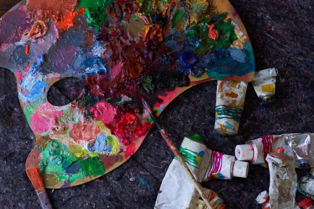 istock palette with mixed acrylic paints.  Creating modern artwork on canvas. improving art painting skills 1589515692