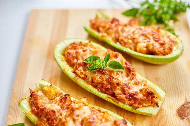 istock Stuffed zucchini on white background, baked loaded 1589516254