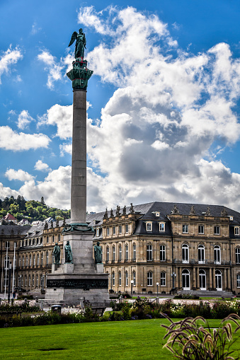 The Jubilee Column is a 30 meter high column, commemorating the 25th anniversary (1841) and the 60th birthday of king Wilhelm I. von Württemberg in 1846. Building started in 1842 after design by architect was Johann Michael von Knapp and in 1846 it was finished. The statues and reliefs were made by the sculptor Theodor Wagner. The statues represent the four estates; three of the four reliefs represent the king's military successes against Napoleon Bonaparte, only one is devoted to a political event. In 1863 a 5 m high statue of Concordia by Ludwig von Hofer was placed on the top.  The Dominant Building is Ministry of Economics, Labor and Tourism Baden-Württemberg as part of the New Palace In Stuttgart.
