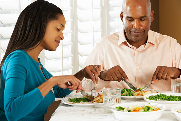 istock Couple Enjoying Meal At Home 158953504