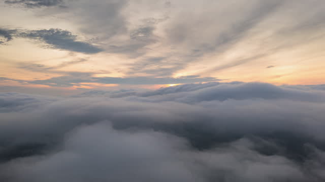 Hyperlapse video Animated 4K aerial view The beauty of morning scenery: golden light, sunrise above the clouds or fog, Ban Pang Puai, Mae Moh, Lampang, Thailand