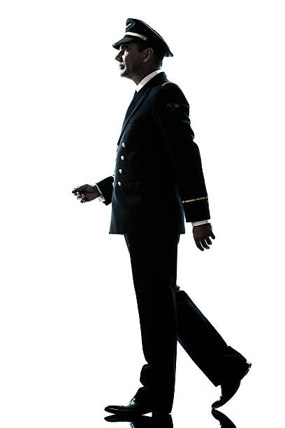 istock man in airline pilot uniform silhouette walking 158957651