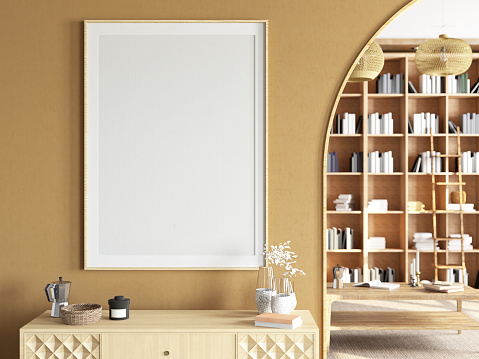 Empty Mock-Up Picture Frame on Cozy Beige Room's Wall with a Library as a Background. 3D Render