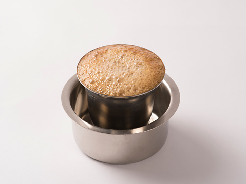 Indian filter coffee on white background