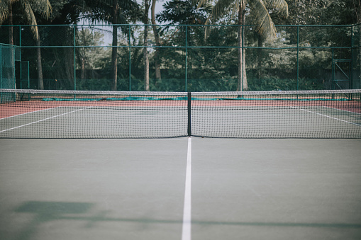 empty tennis court in the morning harcourt