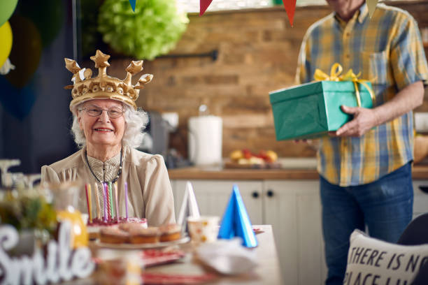 istock A Heartfelt Surprise: Grandpa's Birthday Gift Brings Joy to Grandma 1589628421