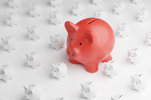 Larger red piggy bank standing around smaller white piggy banks on white background. Illustration of the concept of profitable and outperformed investment