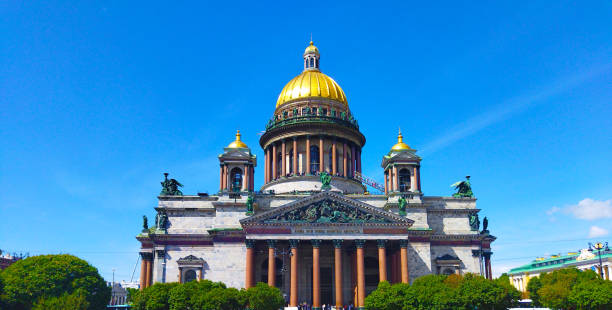 istock St. Isaac's Cathedral (Isaakievskiy Sobor) with golden dome against blue sky. 1589681100