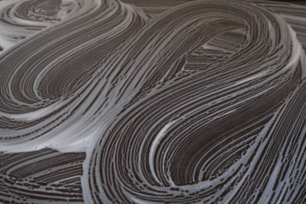 istock white and black abstract background. soap bubble drawing. soap suds abstract background. 1589682162
