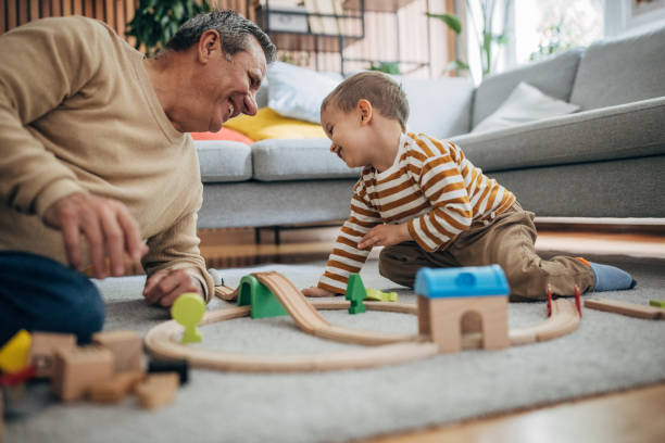 istock Man and grandson playing 1589707424