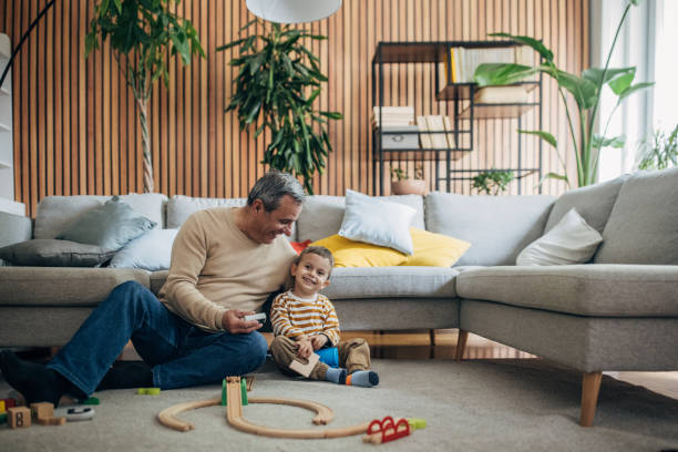 istock Boy and grandfather playing together 1589710120