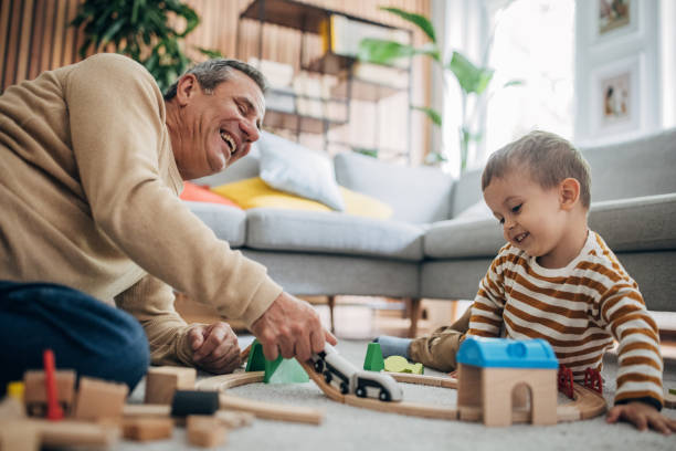 istock Boy and grandfather having fun 1589715001