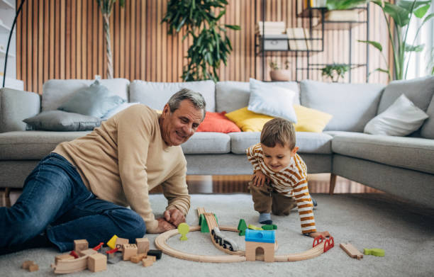 istock Boy and grandfather having fun 1589715025