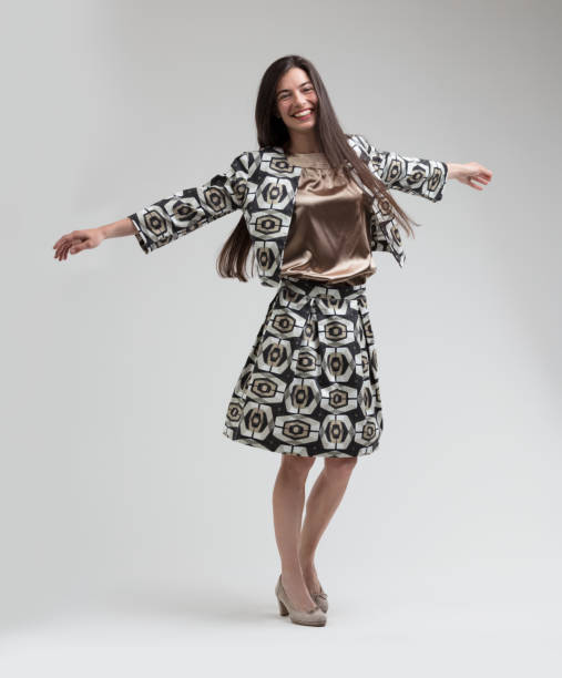 istock Model twirls joyfully in tailored dress 1589715537