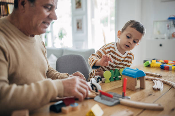 istock Grandfather and grandson playing 1589734480