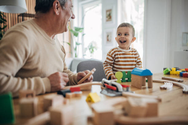 istock Grandfather and grandson playing 1589735569