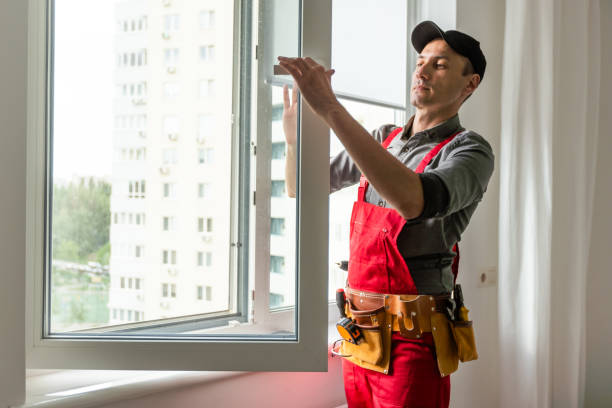 istock Construction worker repairing plastic window with electric screwdriver indoors 1589750098