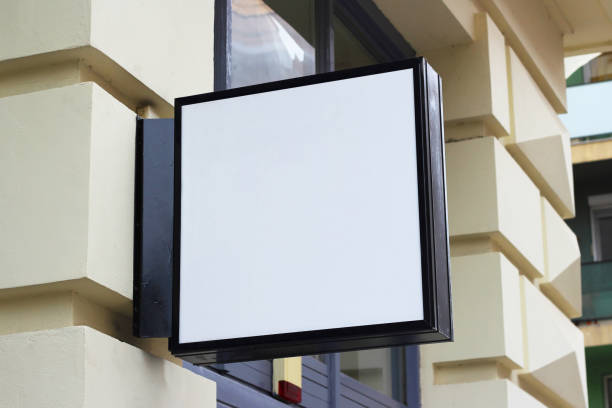 istock Blank white store sign design light box mockup. Storefront, shop, cafe, restaurant mounted signboard mock up design template. 1589754600